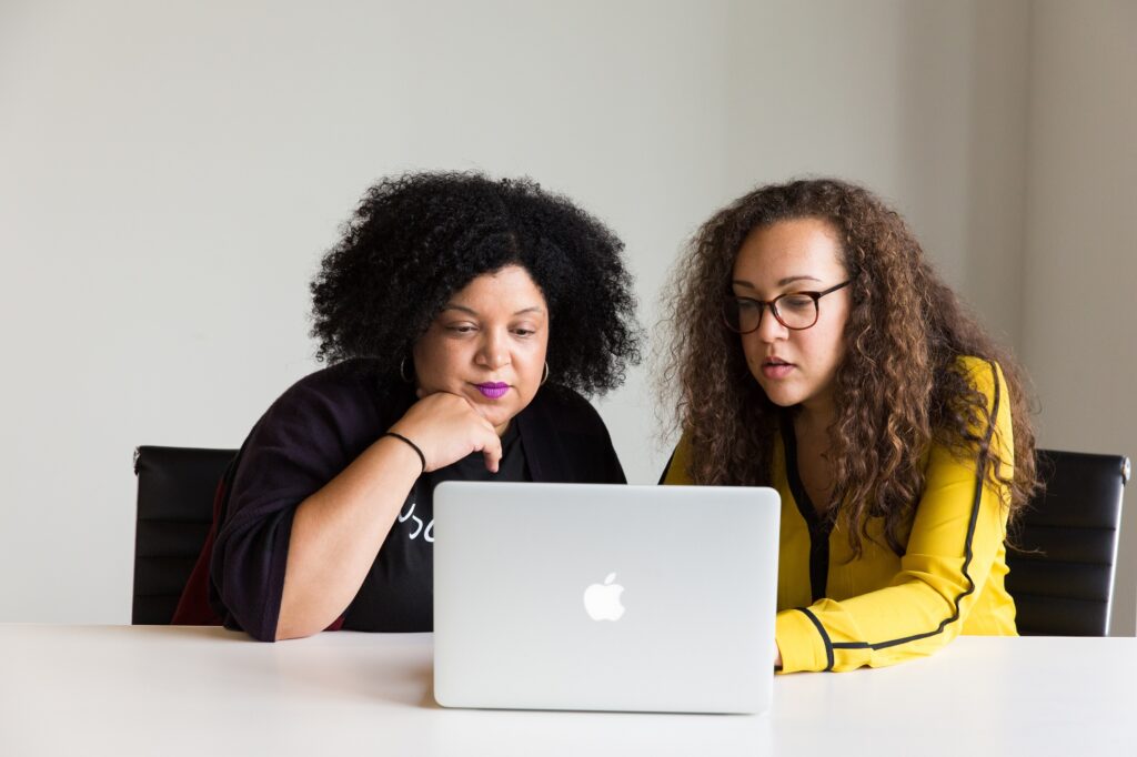 Women looking at MacBook